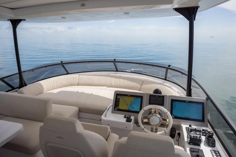 Seahawk Yacht Photos Pics Luxurious 2025 Azimut Magellano 66 yacht interior with modern navigation system and plush seating.