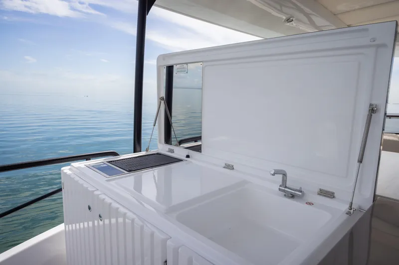 Seahawk Yacht Photos Pics Outdoor kitchen on 2025 Azimut Magellano 66 yacht with ocean view.