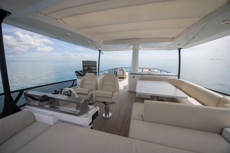 Seahawk Yacht Photos Pics Luxurious 2025 Azimut Magellano 66 yacht interior with elegant seating and ocean view.
