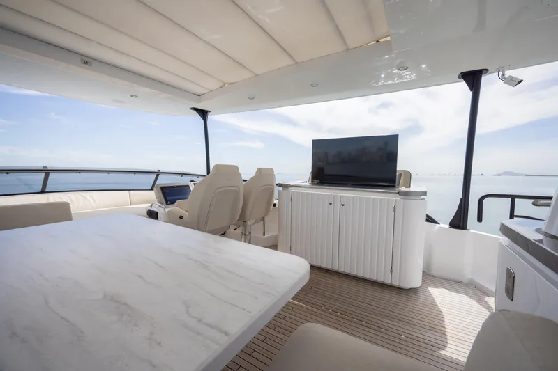 Seahawk Yacht Photos Pics Luxurious 2025 Azimut Magellano 66 yacht interior with modern seating and ocean view.