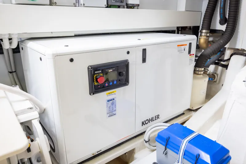 Seahawk Yacht Photos Pics Engine room of 2025 Azimut Magellano 66 yacht featuring Kohler generator.