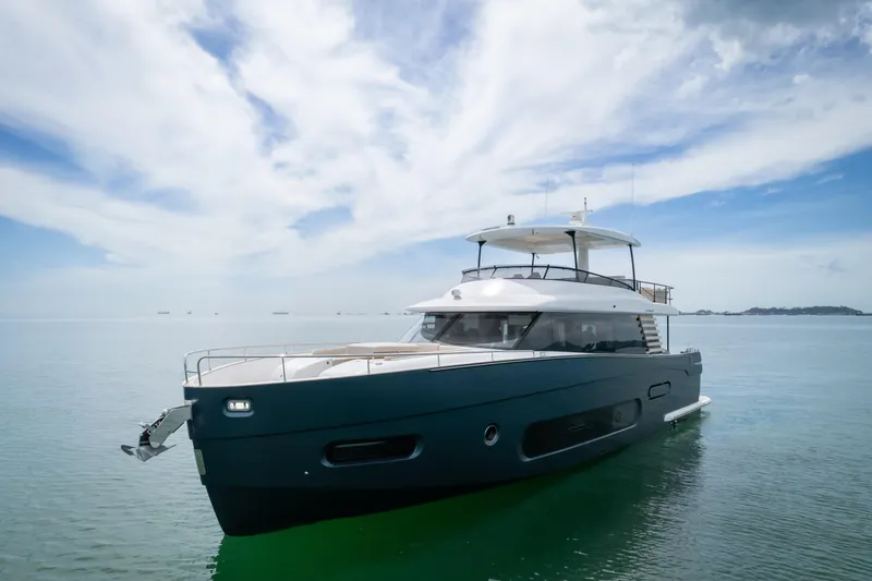 Seahawk Yacht Photos Pics 2025 Azimut Magellano 66 yacht on calm sea under blue sky.