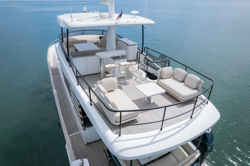 Seahawk Yacht Photos Pics Luxurious 2025 Azimut Magellano 66 yacht with spacious upper deck and elegant seating.