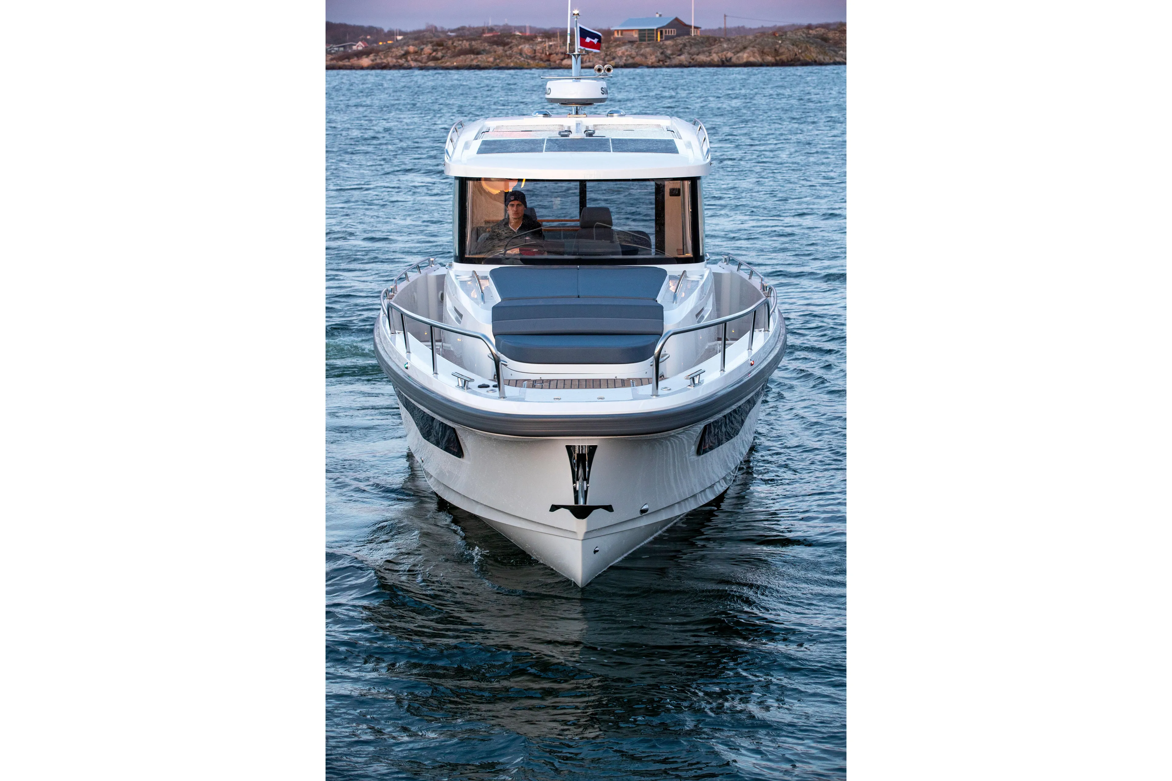  Yacht Photos Pics 2024 Nimbus C11 boat on water, front view with sleek design and modern features.