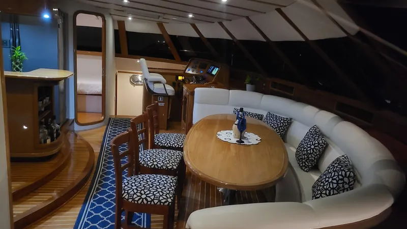 Sovereign Yacht Photos Pics Luxurious interior of 2006 Lidgard Custom Catamaran with elegant dining area and plush seating.