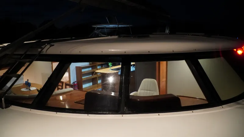Sovereign Yacht Photos Pics 2006 Lidgard Custom Catamaran interior view through windows at night.
