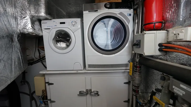 Sovereign Yacht Photos Pics Laundry appliances in a 2006 Lidgard Custom Catamaran's utility area.