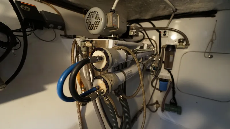 Sovereign Yacht Photos Pics Engine room of 2006 Lidgard Custom Catamaran with complex piping and machinery.