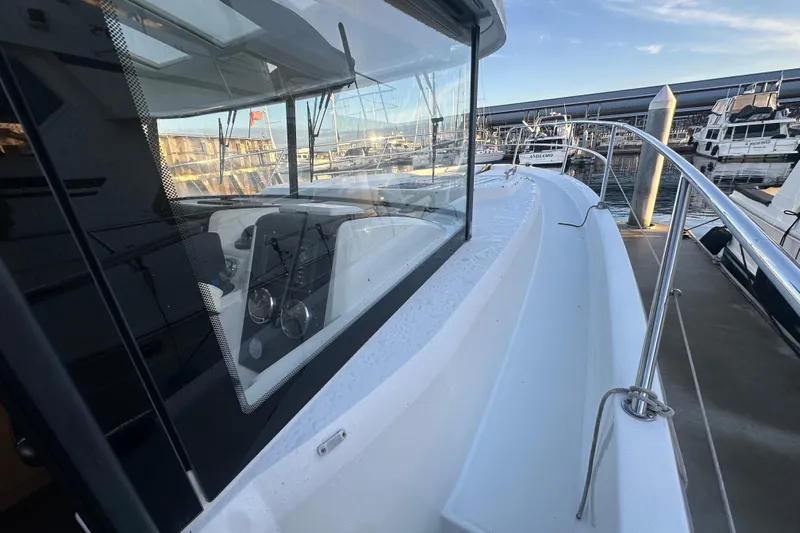 Couples Therapy Yacht Photos Pics 2014 Jeanneau Velasco 43 yacht docked at marina, showcasing sleek design and modern features.