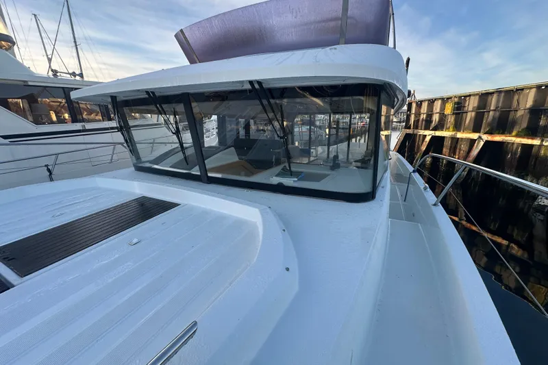 Couples Therapy Yacht Photos Pics 2014 Jeanneau Velasco 43 yacht docked, showcasing sleek design and spacious deck.