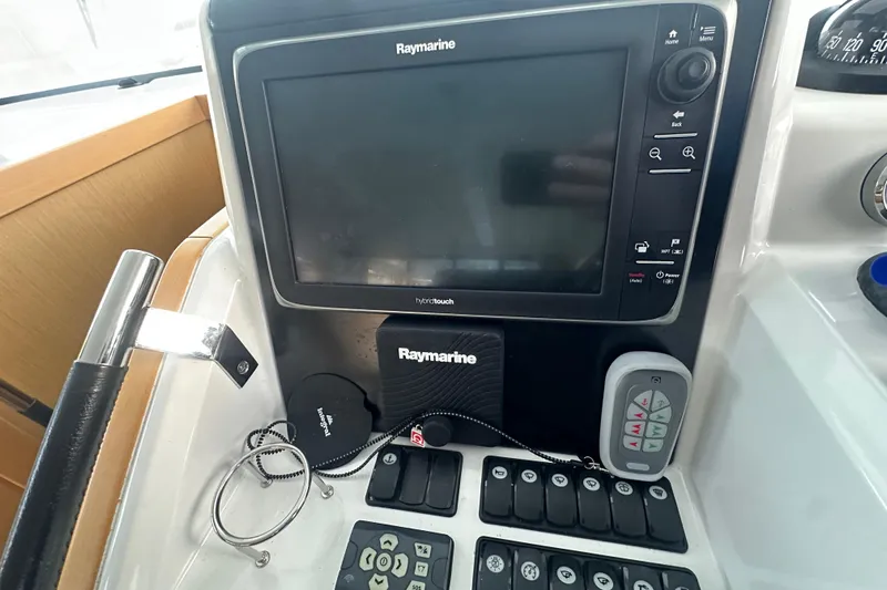 Couples Therapy Yacht Photos Pics Control panel of 2014 Jeanneau Velasco 43 with Raymarine navigation system.