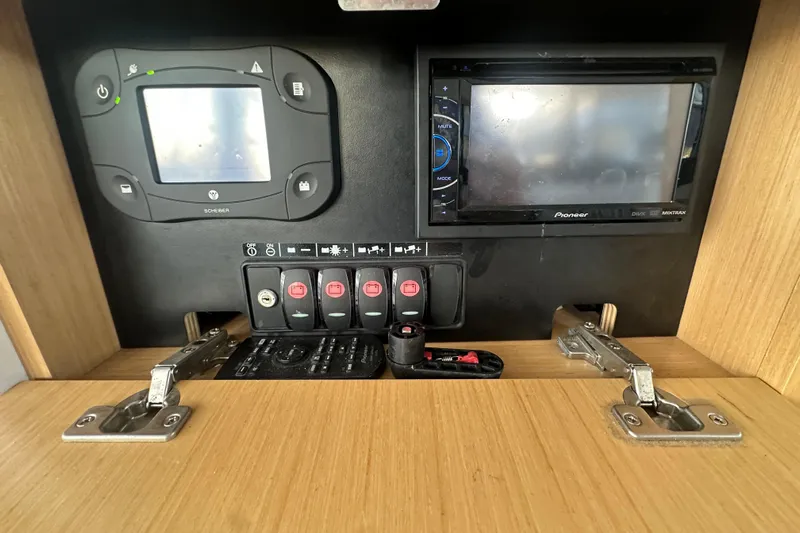 Couples Therapy Yacht Photos Pics Control panel of 2014 Jeanneau Velasco 43 boat with electronic displays and switches.