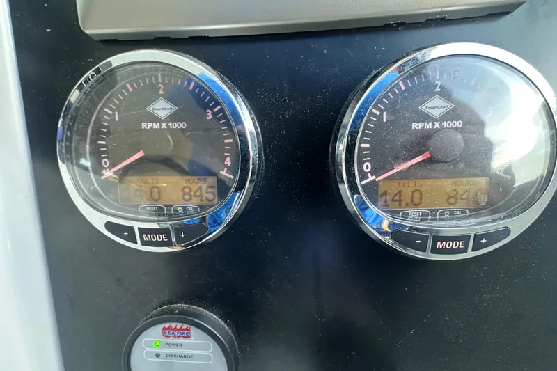Couples Therapy Yacht Photos Pics Close-up of Jeanneau Velasco 43 boat's RPM gauges, displaying voltage and engine hours.