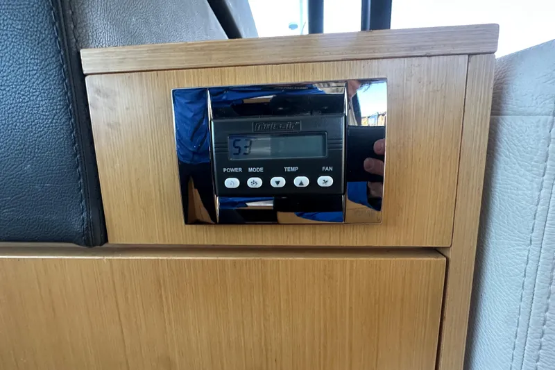 Couples Therapy Yacht Photos Pics Control panel on 2014 Jeanneau Velasco 43 yacht, featuring temperature and fan settings.