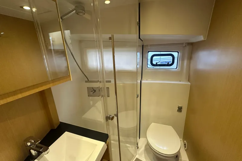 Couples Therapy Yacht Photos Pics Bathroom interior of 2014 Jeanneau Velasco 43 yacht with shower and toilet.