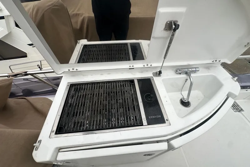 Couples Therapy Yacht Photos Pics Outdoor grill and sink on a 2014 Jeanneau Velasco 43 yacht deck.