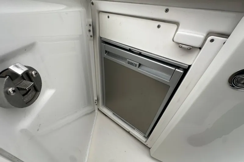 Couples Therapy Yacht Photos Pics Compact Waeco fridge in 2014 Jeanneau Velasco 43 boat interior.