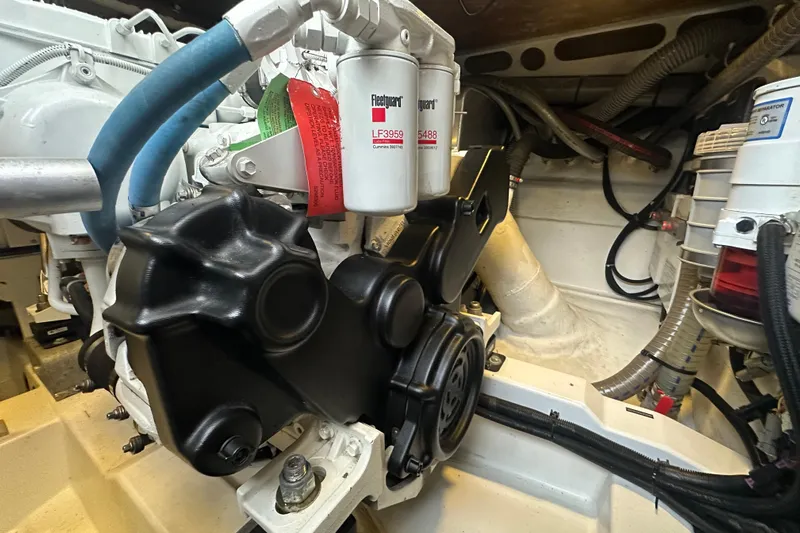 Couples Therapy Yacht Photos Pics Engine compartment of a 2014 Jeanneau Velasco 43, showcasing mechanical components and filters.