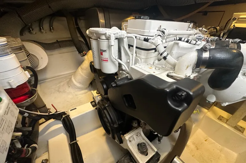 Couples Therapy Yacht Photos Pics Engine room of 2014 Jeanneau Velasco 43 yacht, showcasing detailed mechanical components.