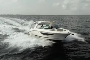  Yacht Photos Pics 2023 Sea Ray SLX 350 Outboard cruising on open water, showcasing sleek design and performance.