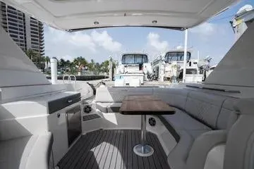  Yacht Photos Pics 2023 Sea Ray SLX 350 Outboard interior with seating and table, docked at marina.