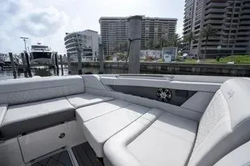  Yacht Photos Pics 2023 Sea Ray SLX 350 Outboard luxury boat interior with plush seating at marina.