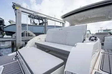  Yacht Photos Pics 2023 Sea Ray SLX 350 Outboard luxury seating area at a marina.