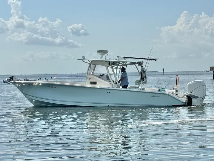  Yacht Photos Pics 2007 Palmetto 33 Custom boat on calm water under a cloudy sky.