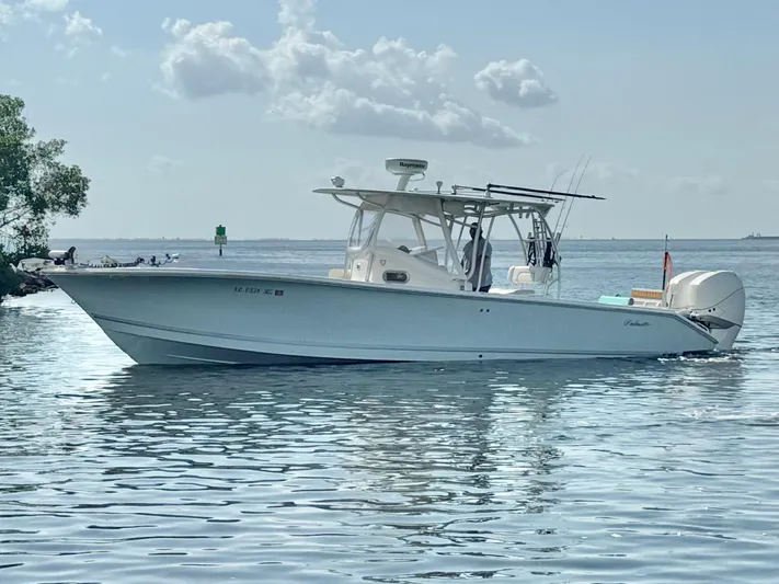 Yacht Photos Pics 2007 Palmetto 33 Custom boat on calm water under a partly cloudy sky.