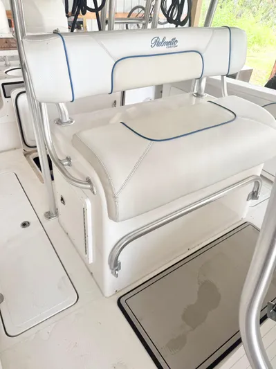  Yacht Photos Pics White seating on 2007 Palmetto 33 Custom boat with blue accents and metal frame.