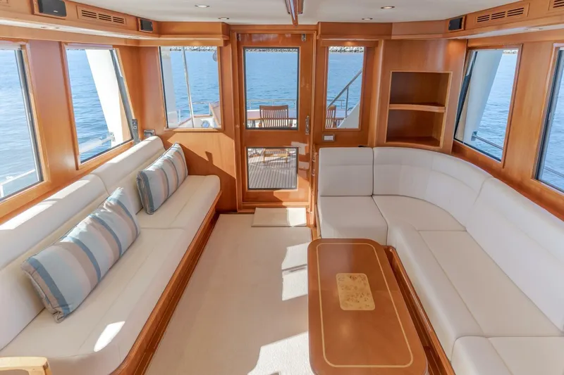 Tintagel Yacht Photos Pics Luxurious interior of 2008 Grand Banks 59 Aleutian RP yacht with elegant seating and ocean view.
