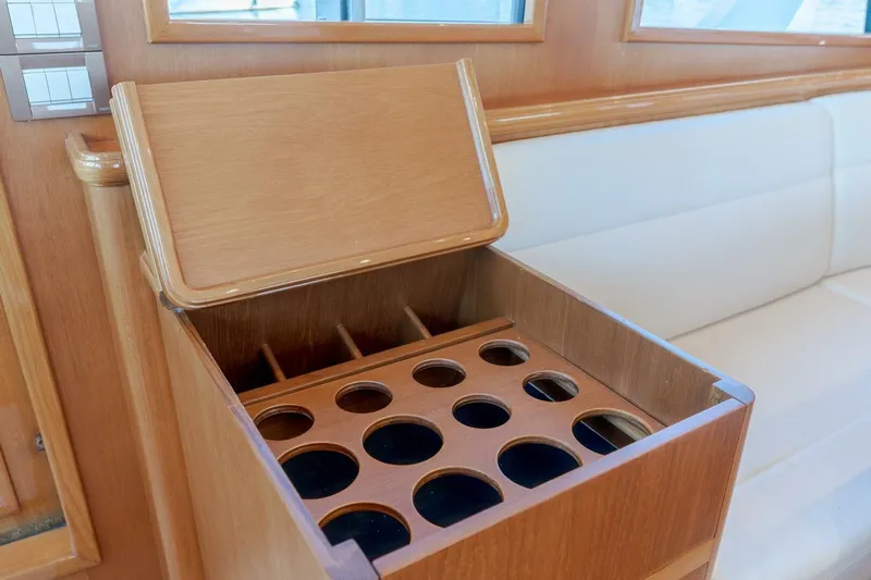 Tintagel Yacht Photos Pics Wooden storage compartment on 2008 Grand Banks 59 Aleutian RP yacht interior.