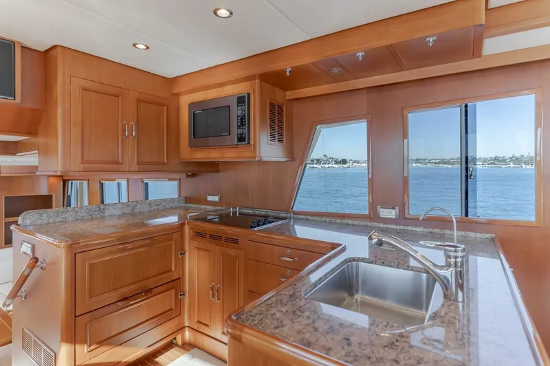 Tintagel Yacht Photos Pics Luxurious kitchen interior of 2008 Grand Banks 59 Aleutian RP yacht with ocean view.