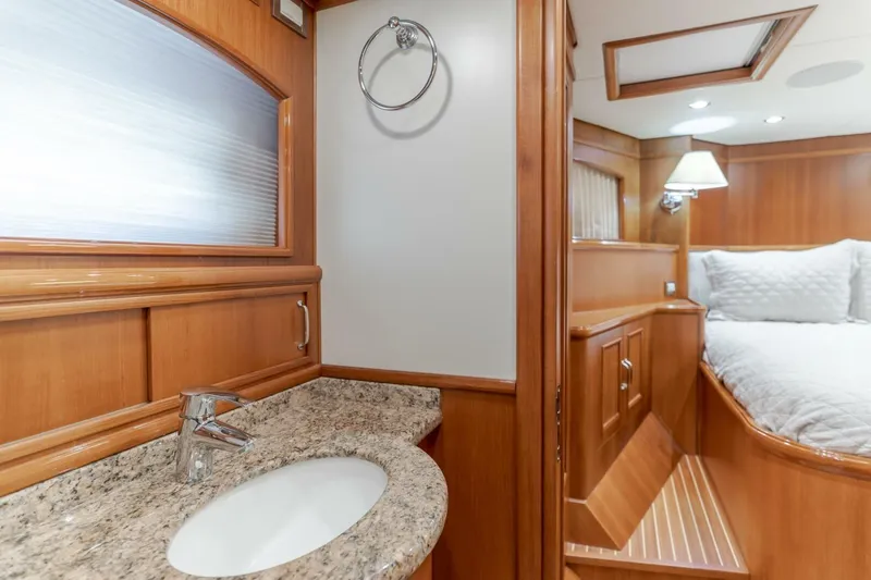 Tintagel Yacht Photos Pics Luxurious 2008 Grand Banks 59 Aleutian RP yacht interior with elegant wood finish and cozy bedroom.