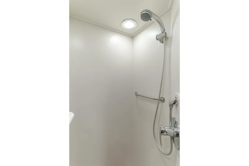 Tintagel Yacht Photos Pics Shower area in 2008 Grand Banks 59 Aleutian RP yacht, featuring modern fixtures.