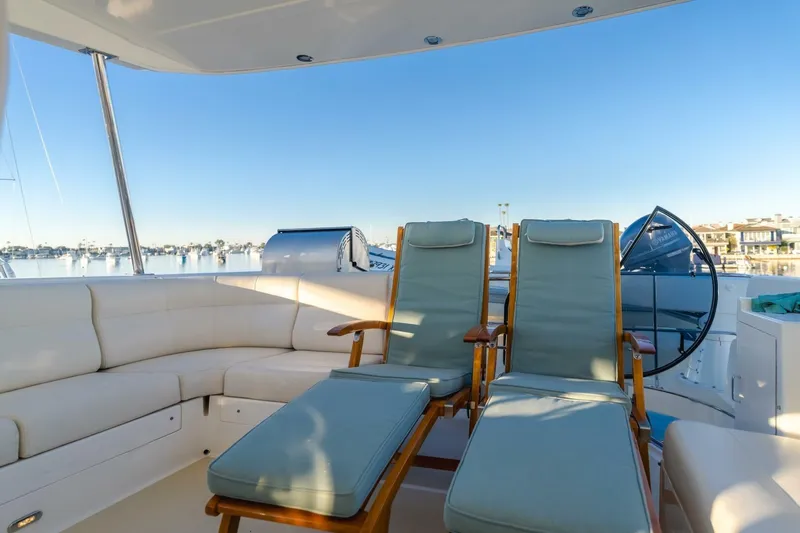 Tintagel Yacht Photos Pics Luxurious seating on 2008 Grand Banks 59 Aleutian RP yacht, overlooking serene marina.