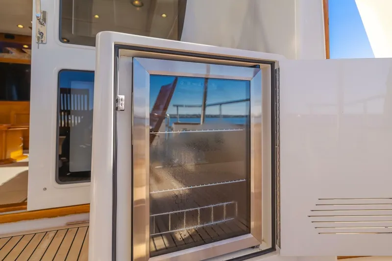 Tintagel Yacht Photos Pics Open refrigerator on 2008 Grand Banks 59 Aleutian RP yacht deck.