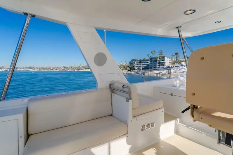 Tintagel Yacht Photos Pics Luxurious 2008 Grand Banks 59 Aleutian RP yacht interior with ocean view and comfortable seating.