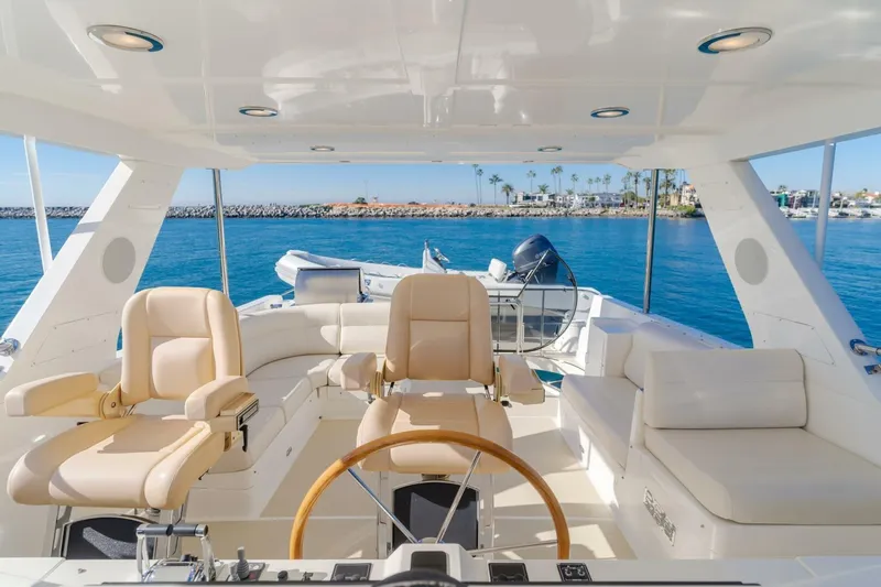 Tintagel Yacht Photos Pics Luxurious 2008 Grand Banks 59 Aleutian RP yacht interior with plush seating and ocean view.