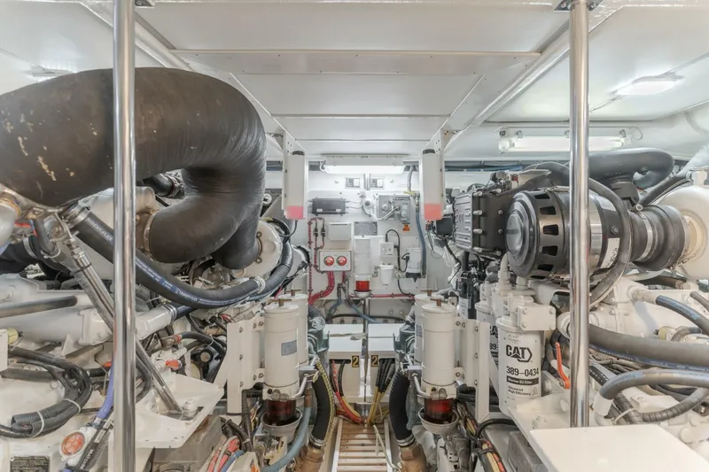 Tintagel Yacht Photos Pics Engine room of 2008 Grand Banks 59 Aleutian RP yacht, showcasing mechanical components.