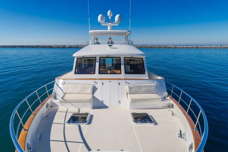 Tintagel Yacht Photos Pics 2008 Grand Banks 59 Aleutian RP yacht on calm blue waters, clear sky.