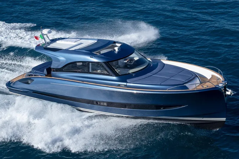  Yacht Photos Pics 2026 Solaris Power 48 Coupe yacht cruising on open sea, showcasing sleek design and performance.