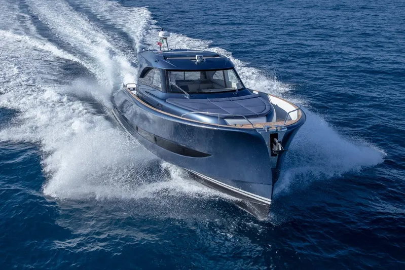  Yacht Photos Pics 2026 Solaris Power 48 Coupe yacht cruising on open sea, showcasing sleek design and performance.