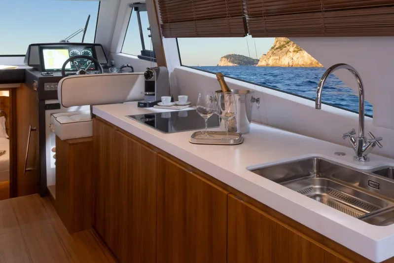  Yacht Photos Pics Luxurious interior of 2026 Solaris Power 48 Coupe yacht with modern kitchen and ocean view.