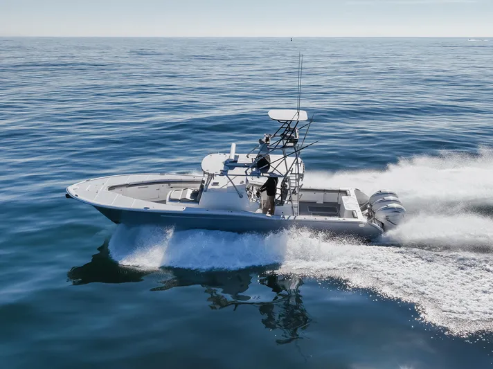 Steam N Demon Yacht Photos Pics 2019 Buddy Davis 42 CC boat cruising on open water, showcasing sleek design and powerful engines.