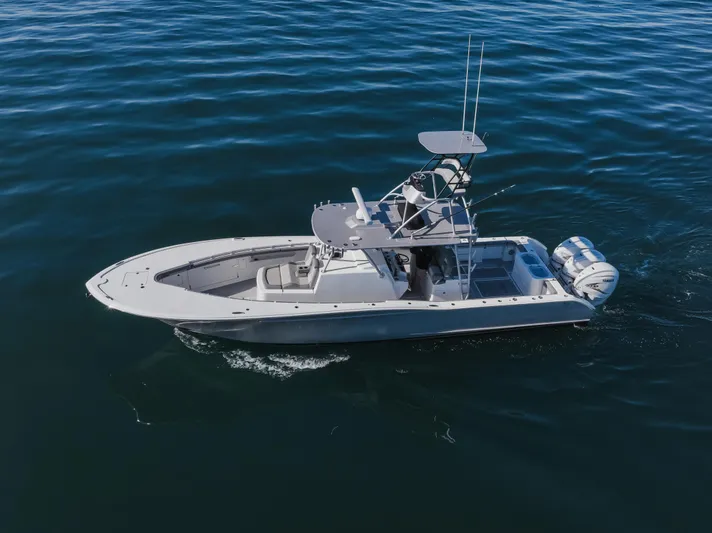 Steam N Demon Yacht Photos Pics 2019 Buddy Davis 42 CC boat cruising on open water, aerial view.