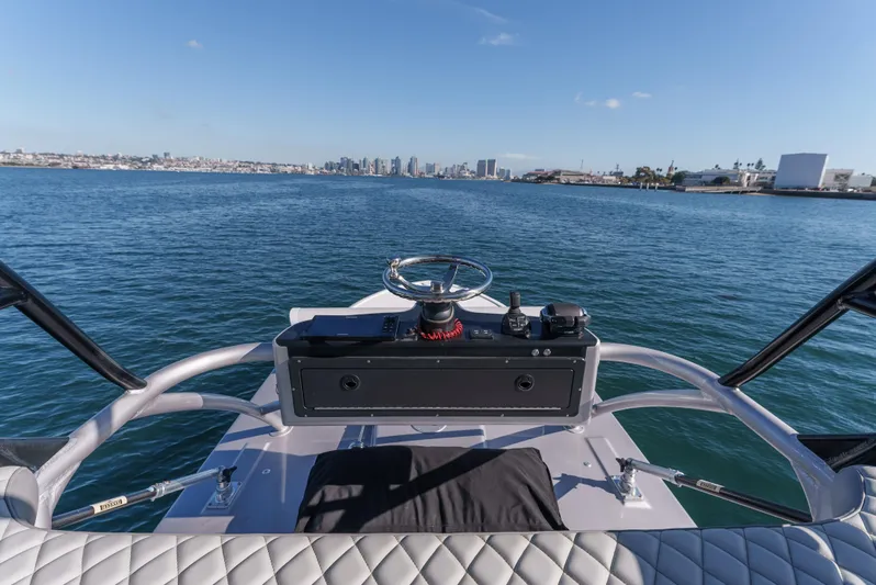 Steam N Demon Yacht Photos Pics 2019 Buddy Davis 42 CC boat helm with ocean and city skyline view.