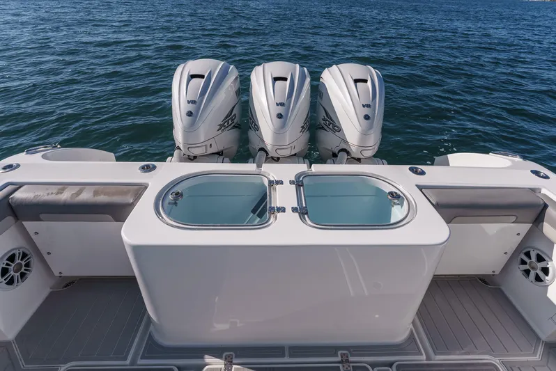 Steam N Demon Yacht Photos Pics 2019 Buddy Davis 42 CC boat with triple outboard engines on open water.