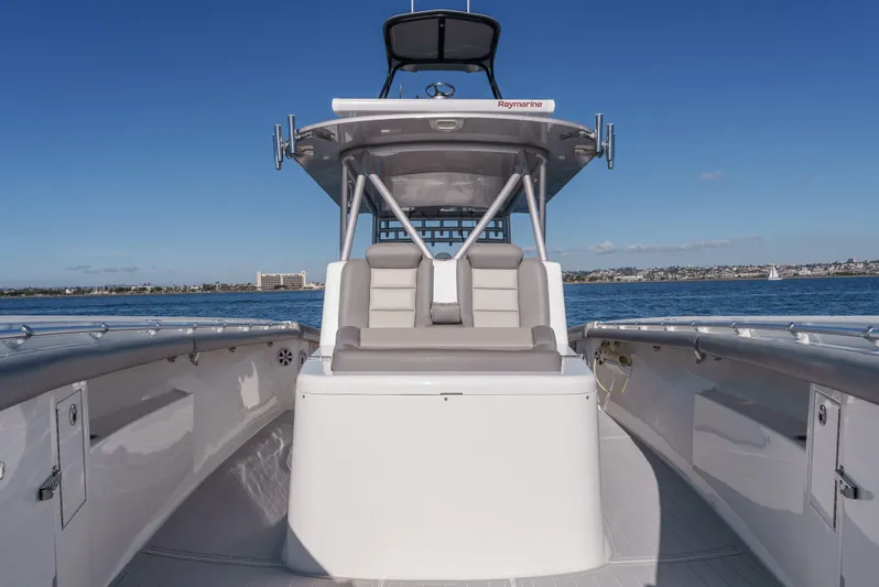 Steam N Demon Yacht Photos Pics 2019 Buddy Davis 42 CC boat on water, featuring sleek design and spacious seating.