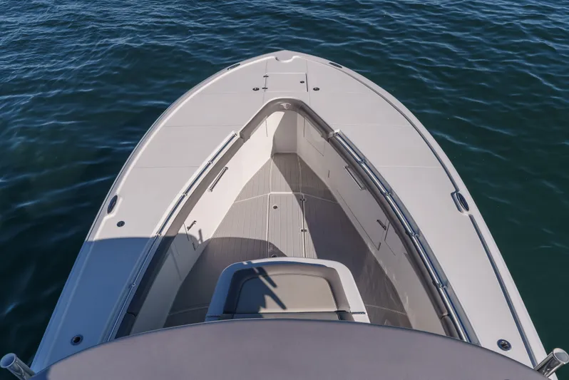 Steam N Demon Yacht Photos Pics 2019 Buddy Davis 42 CC boat bow on calm water, showcasing sleek design and spacious deck.